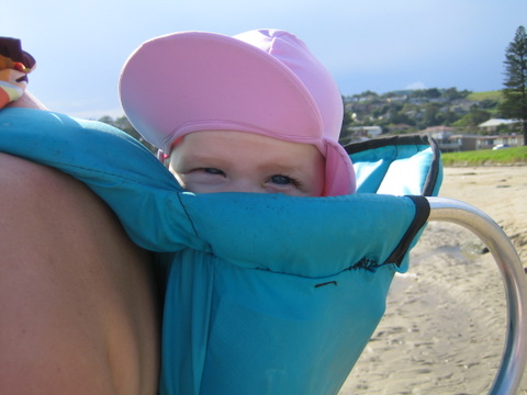 Happy peeping over the top of the back pack